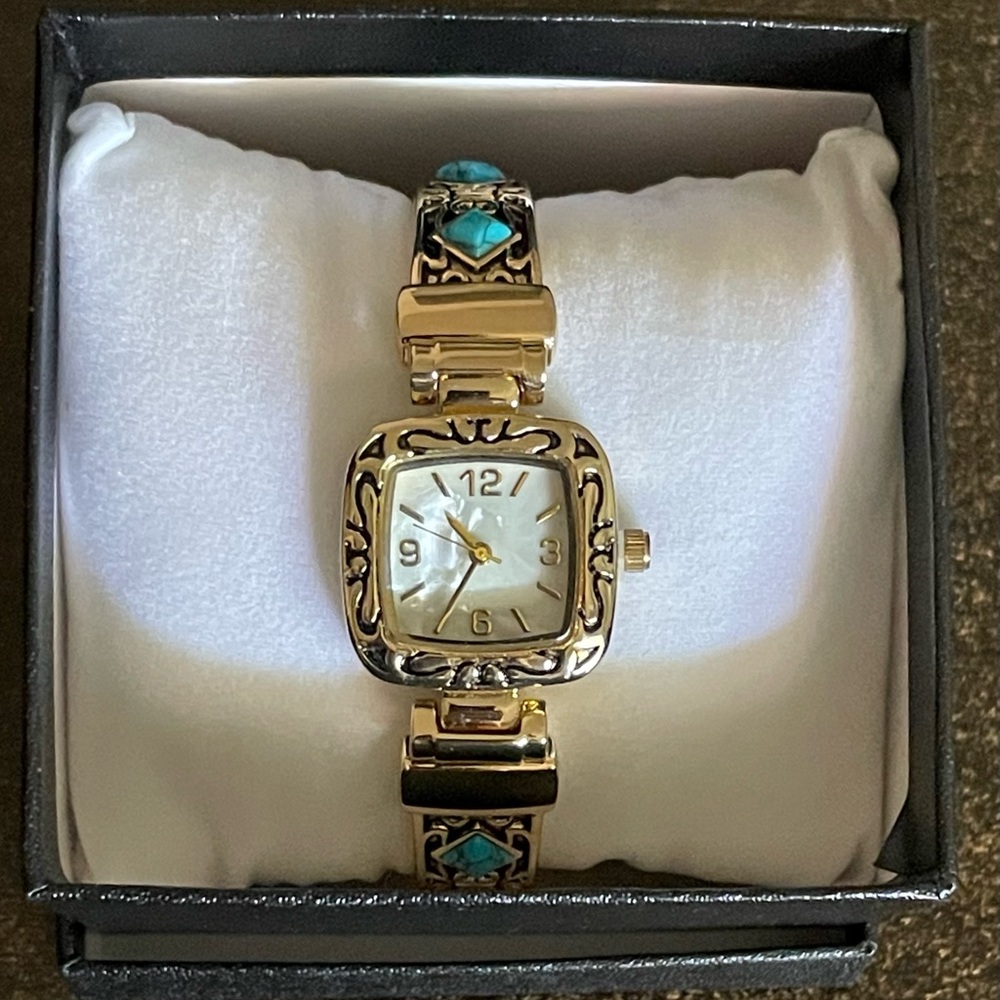 Ladies gold tone bracelet watch with faux turquoise accents
